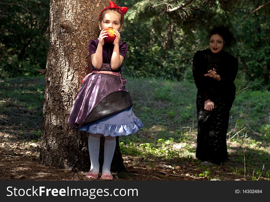 Stepmother gives poisoned apple give to snow white little girl. Stepmother gives poisoned apple give to snow white little girl