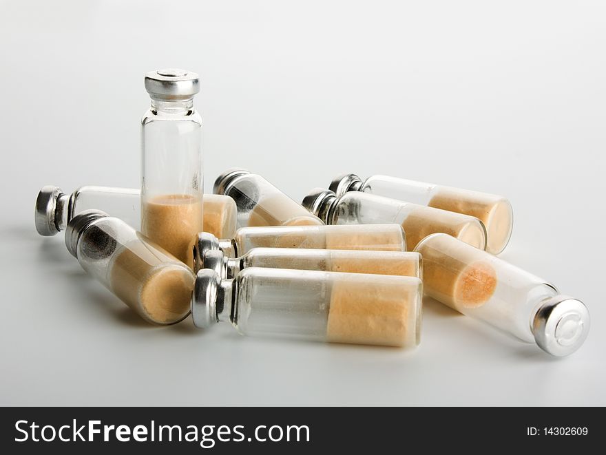 Sealed test tubes with bacteria stand beside, top view
