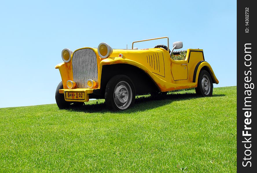 Decorative plaster car in park. Decorative plaster car in park