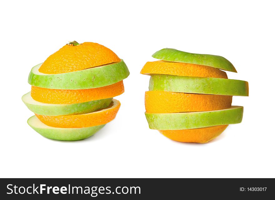 Two sliced oranges and green apples merged together, isolated on white background. Two sliced oranges and green apples merged together, isolated on white background.