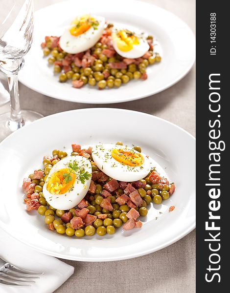 Tasty egg dish with ham and peas