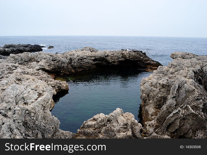 Natural small basin in the rocks in the Black sea. Natural small basin in the rocks in the Black sea