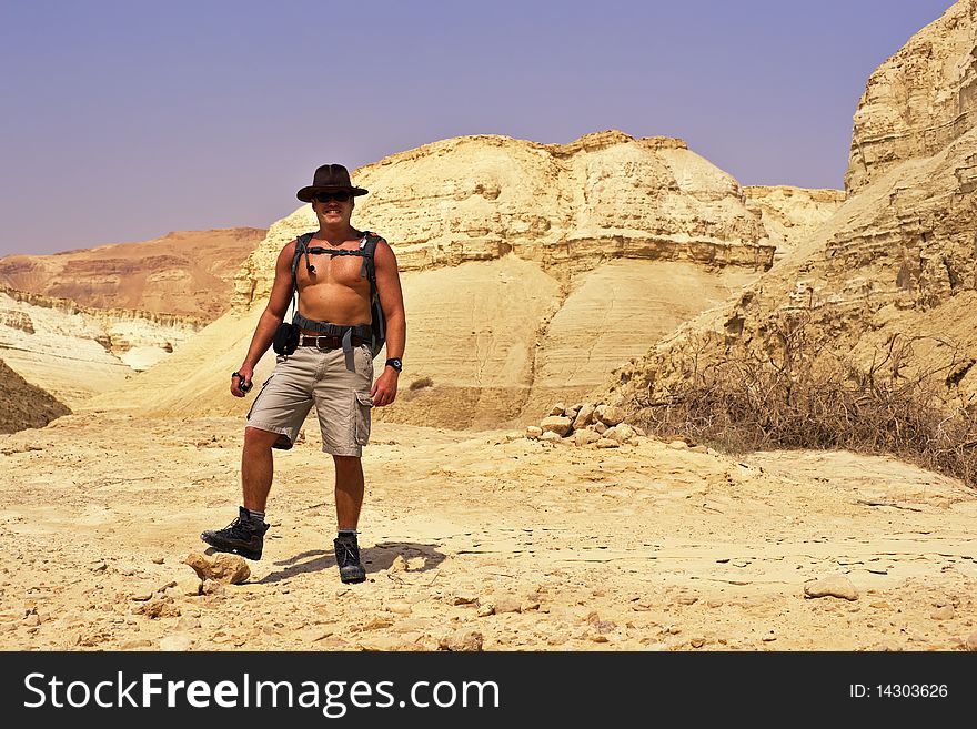 Man hiking with backpack. Negev desert. Israel