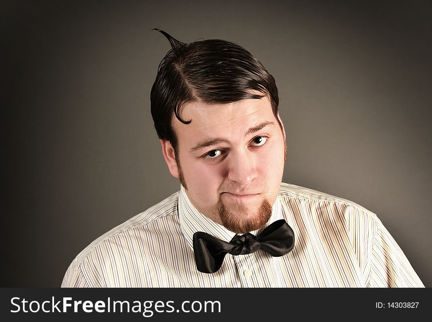 Funny eccentric guy on dark background. Funny eccentric guy on dark background