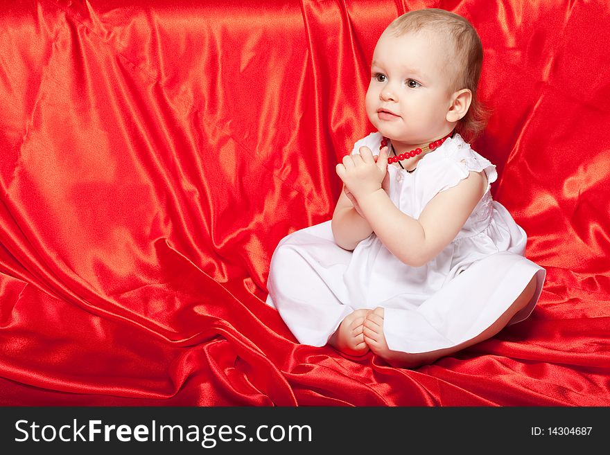 Cute Baby On The Red Silk Cloth