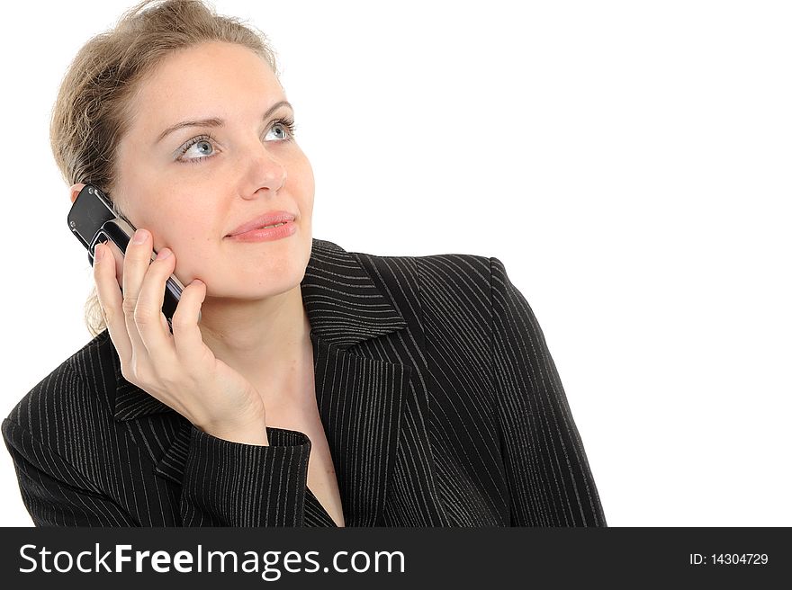 Beautiful woman speaks by phone, on a white background