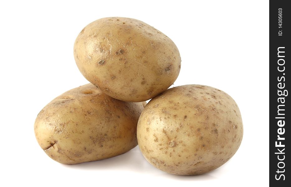 Raw young potatoes on a white background. Raw young potatoes on a white background