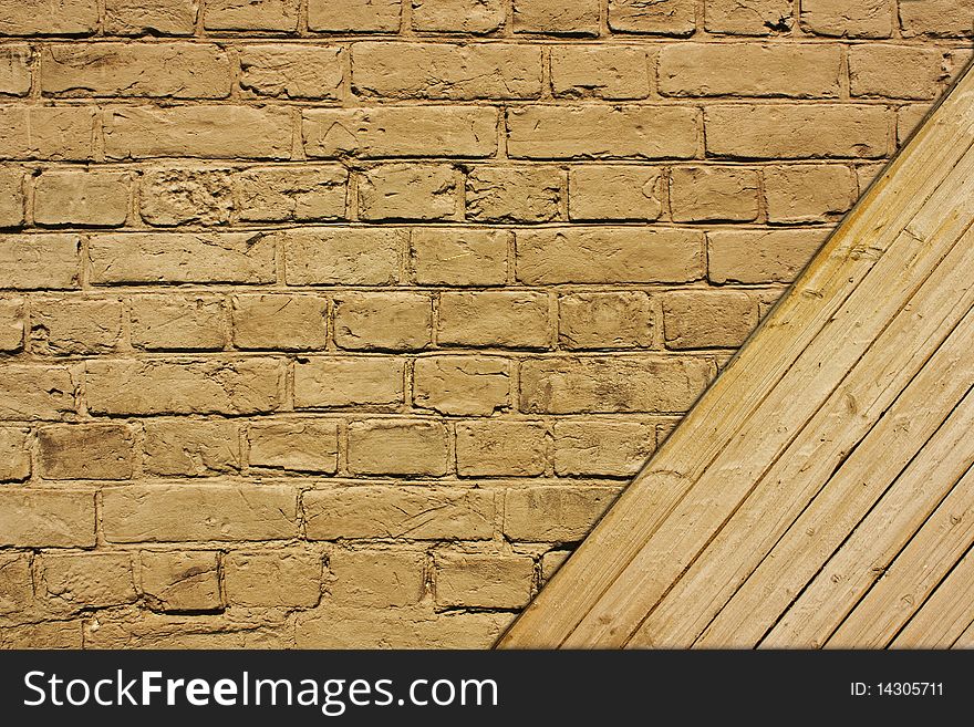 Vintage brown textured brick and wooden wall. Vintage brown textured brick and wooden wall