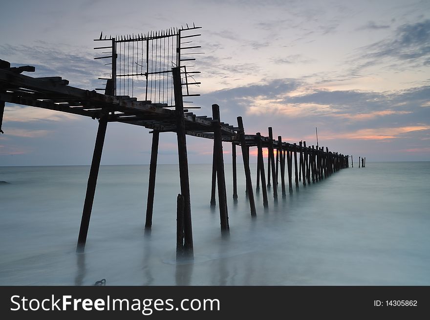 The decay pier and steel gate in the  twilight time