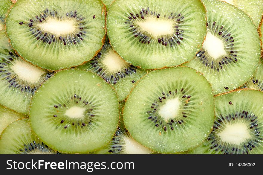 Green slices of kiwi  as background