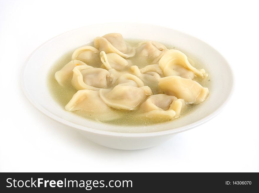 Ravioli in plate  close-up on white background