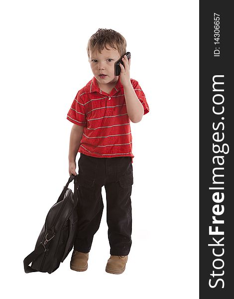 A young boy is in shock while talking on his cell phone. A young boy is in shock while talking on his cell phone.