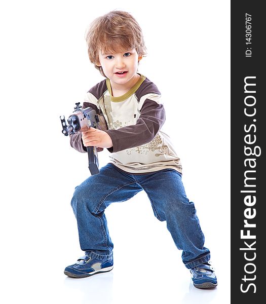 Portrait of little boy with automatic weapon