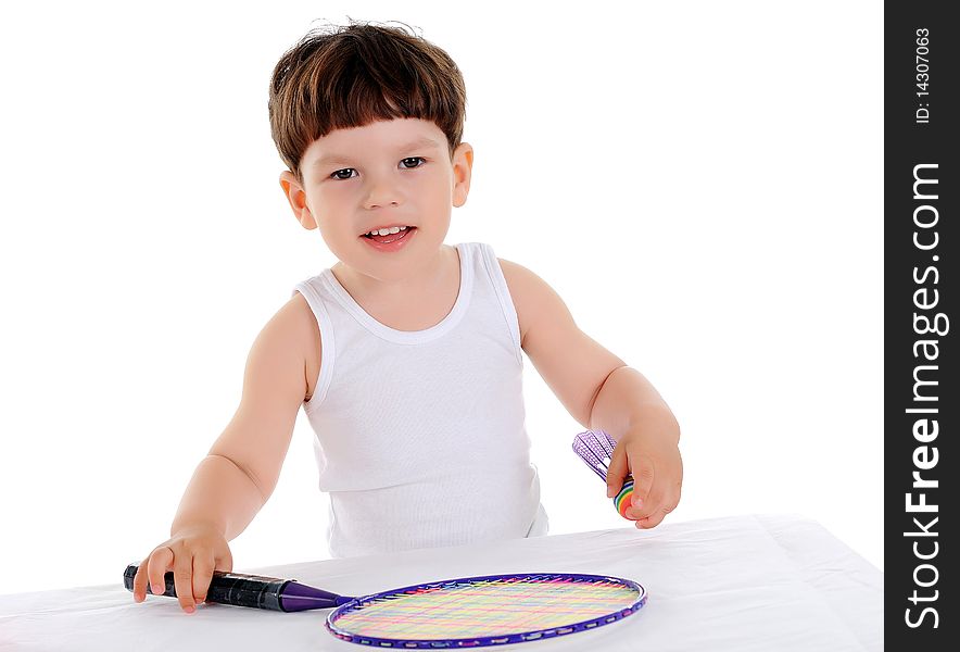 Little boy with a tennis racket on a white background. Little boy with a tennis racket on a white background