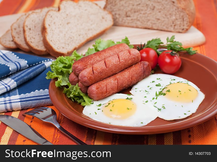 Breakfast fried eggs and sausages