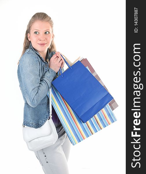 Young girl with purchases on white background