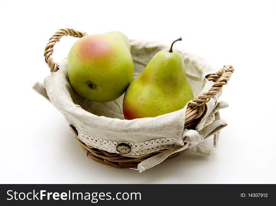 Pears in the basket and onto white background