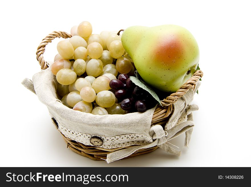 Fresh fruit in the basket onto white background