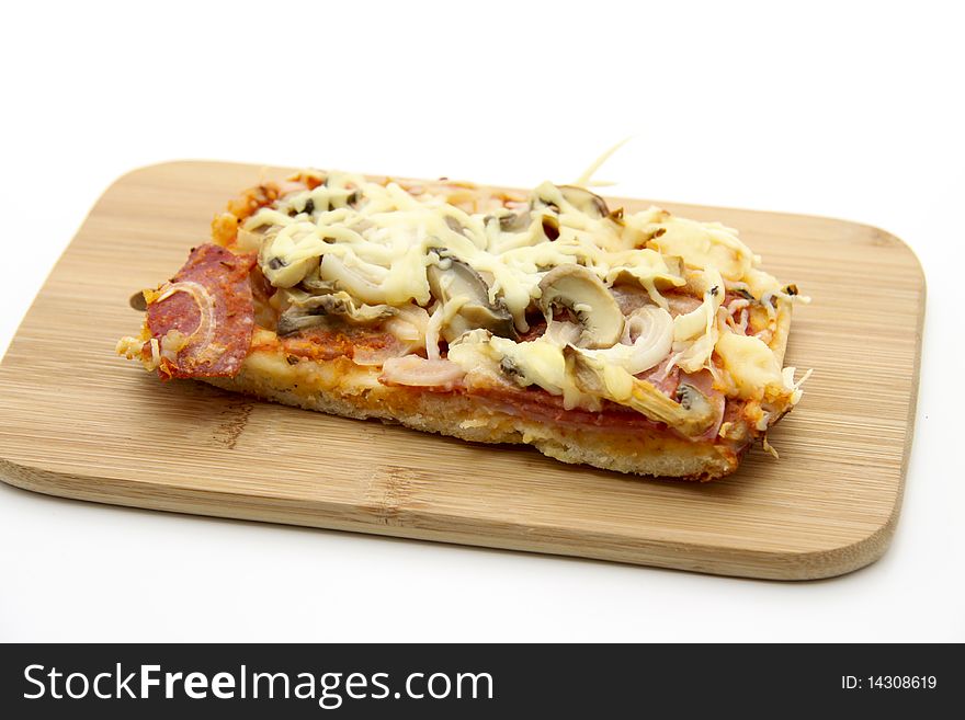 Pizza and mushrooms and onion on edge board