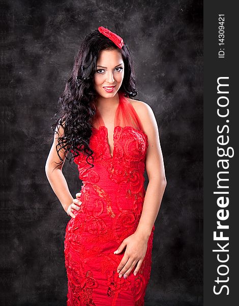 Beautiful glamorous woman with red dress, studio shot