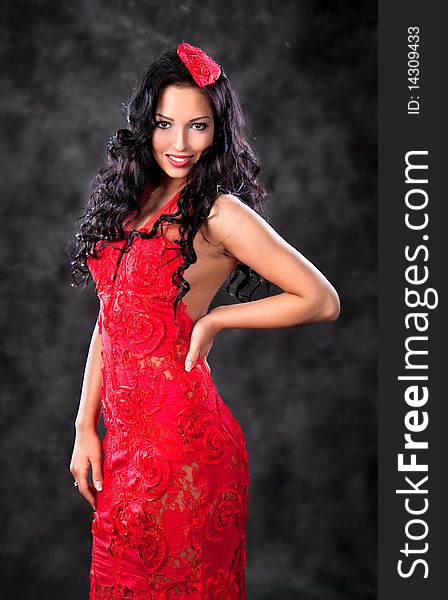 Beautiful glamorous woman with red dress, studio shot