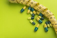 Green And Yellow Medicine Capsule Stock Photo