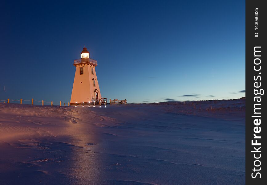Lighthouse at night in winter