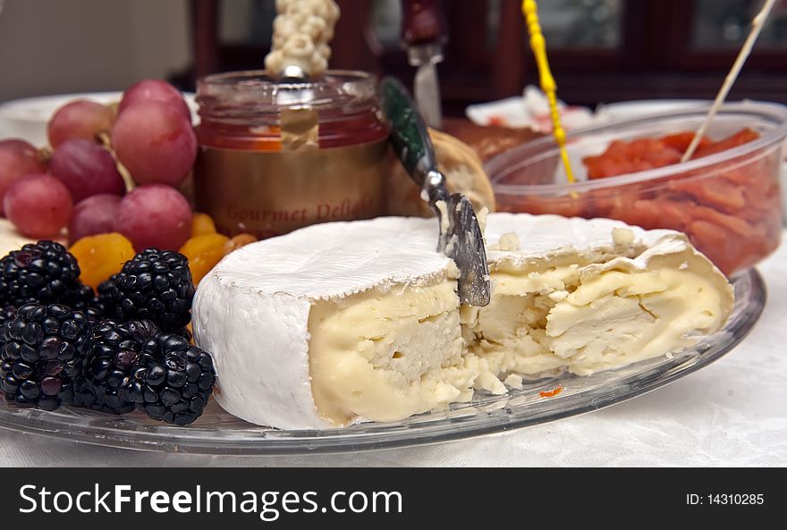 Tray with cheese, grapes, blackberries on the table. Tray with cheese, grapes, blackberries on the table