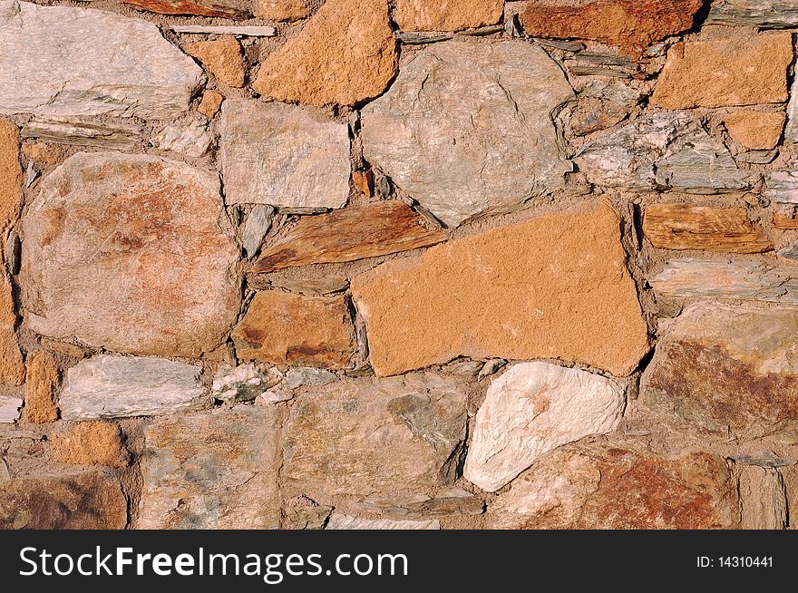 Closeup image of the wall made of natural rocks on Crete island in Greece. Closeup image of the wall made of natural rocks on Crete island in Greece