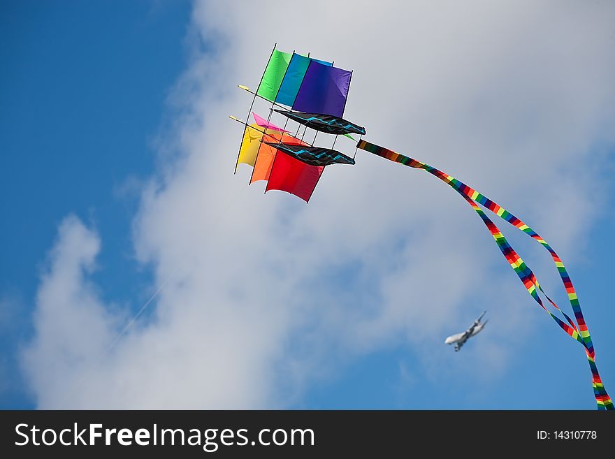 Rainbow Ship kite on sky and clouds background