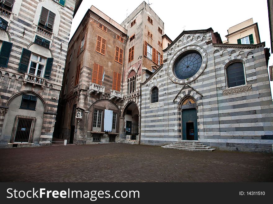 A typical church in the historic center of Genoa. The colors black and white stripes are due to materials used,  marble and slate. A typical church in the historic center of Genoa. The colors black and white stripes are due to materials used,  marble and slate
