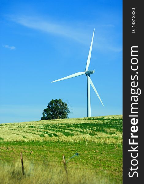 A turbin in a field at wind farm