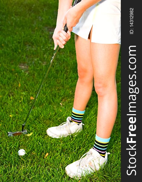 Image of woman playing golf