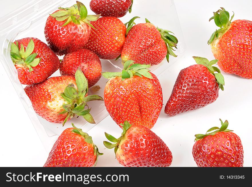 Fresh and tasty strawberries with a box