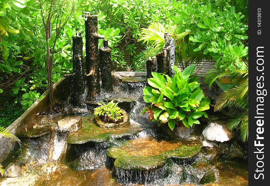 Waterfalls in the garden with plants. Waterfalls in the garden with plants.