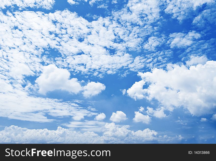Vast blue sky filled with fluffy white clouds. Vast blue sky filled with fluffy white clouds