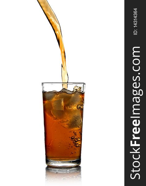 Poring cola into glass isolated on white background