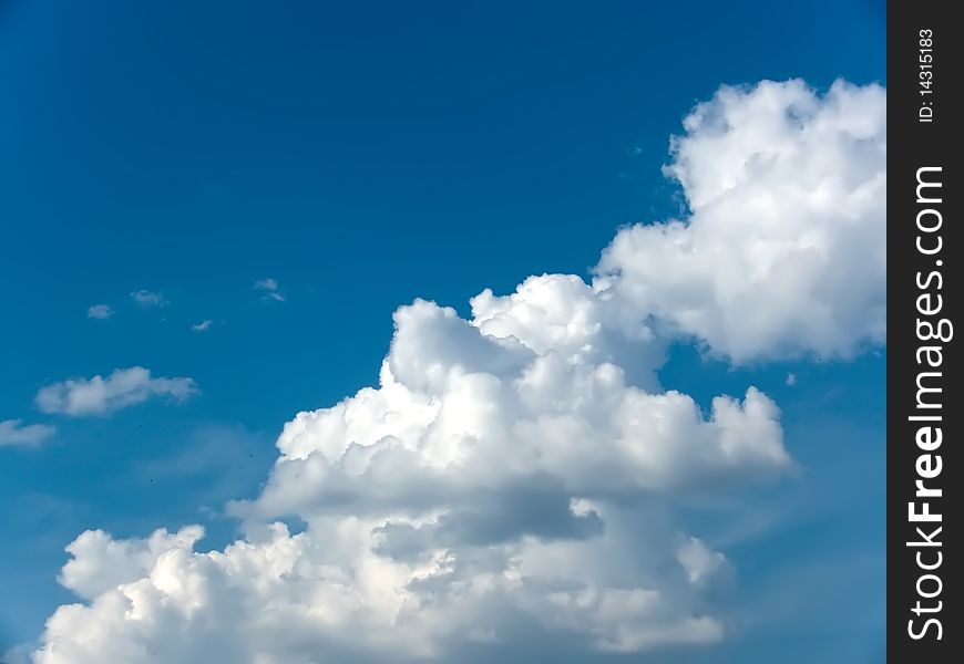 Spring cumulus clouds in the blue sky. Spring cumulus clouds in the blue sky