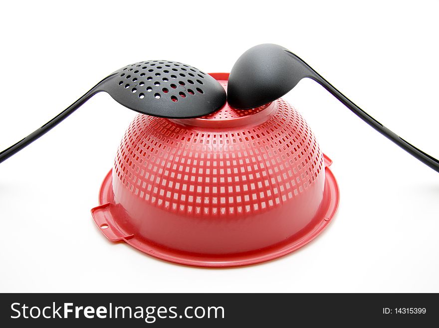 Ladle with kitchen sieve onto white background. Ladle with kitchen sieve onto white background