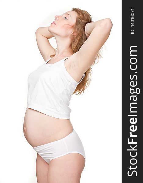 This is a photograph of a beautiful young pregnant woman