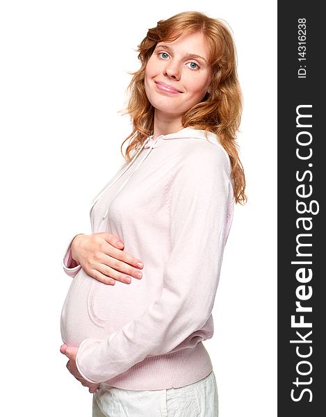Young pregnant woman holding her hands on her tummy. Young pregnant woman holding her hands on her tummy