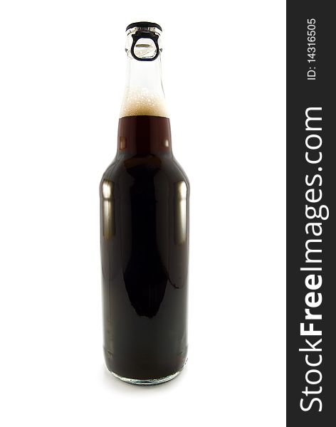 Black beer is in a bottle on white