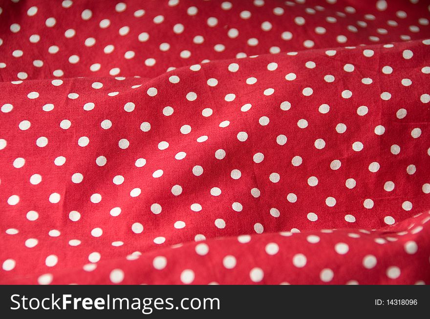 Red textile with white dots. Red textile with white dots