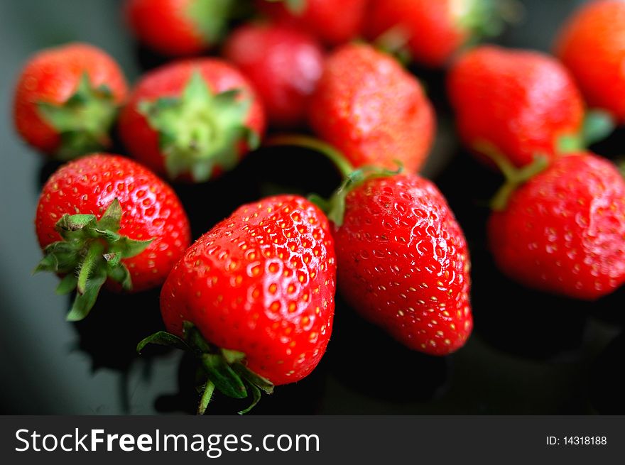 Fresh red strawberry isolated on a blurred background