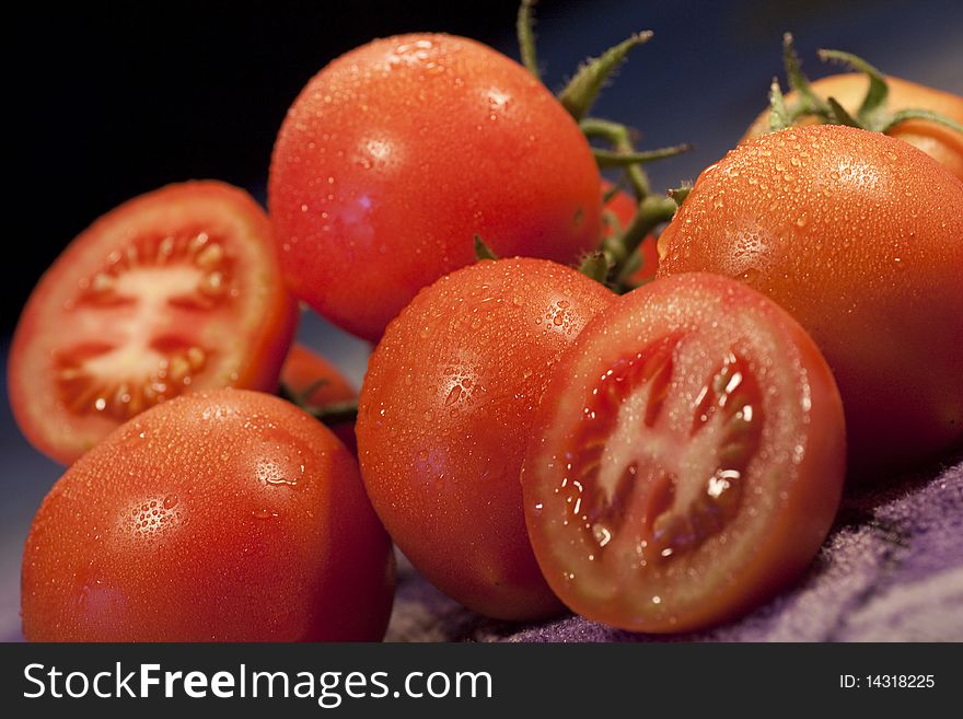 Close view of a slice of tomatoes fruits on top of the table. Close view of a slice of tomatoes fruits on top of the table.