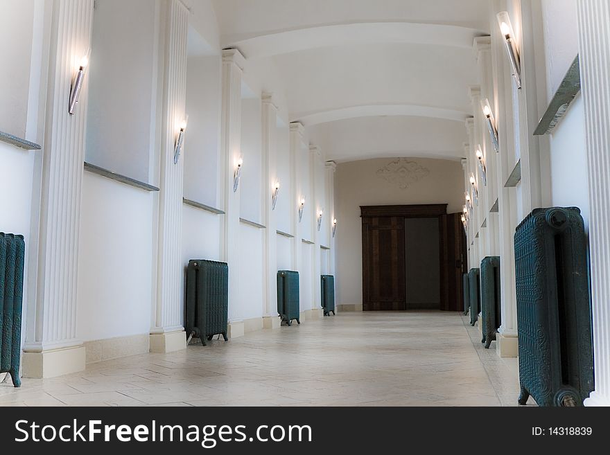 Empty corridor with lamps