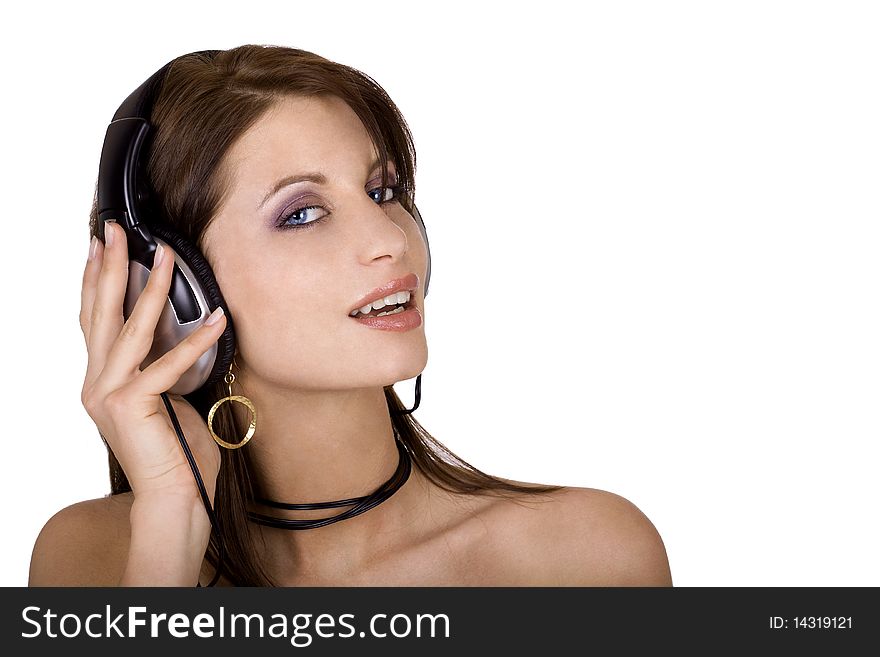 Beautiful brunette woman wearing headphones and listening to music. Beautiful brunette woman wearing headphones and listening to music