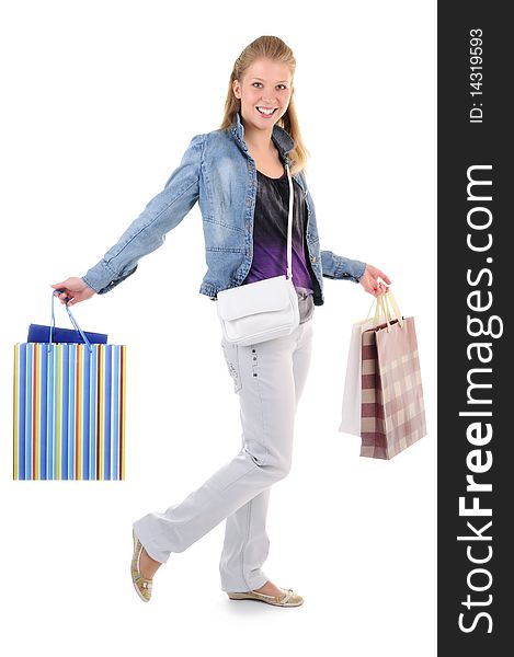 Young girl with purchases on white background