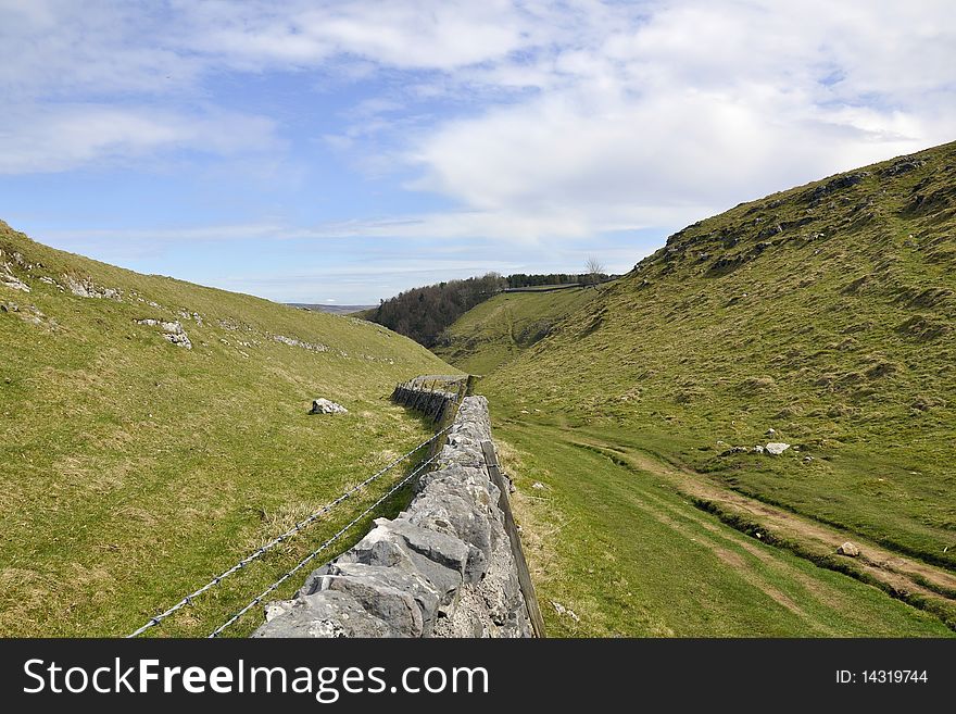 English countryside landscape including rocks, hills, grass, taken on a cloudy sunny day. English countryside landscape including rocks, hills, grass, taken on a cloudy sunny day.