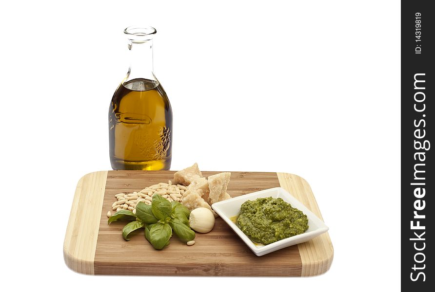 Basil sauce and its ingredients on white background. Basil sauce and its ingredients on white background